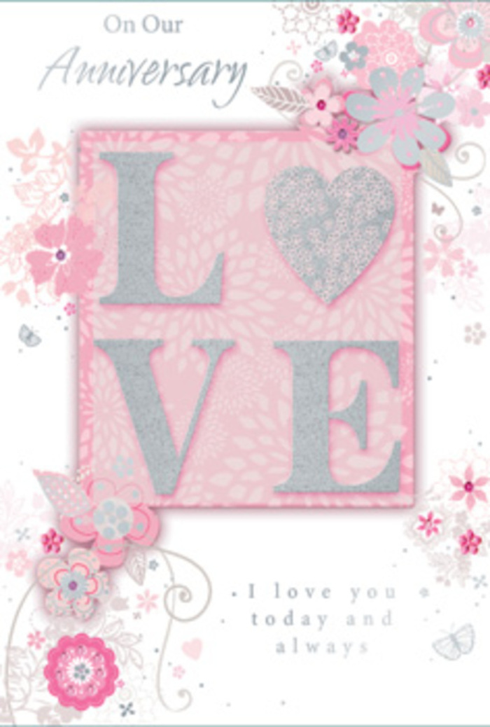 In the photograph, an anniversary card is displayed so that its front and a hint of the inside are visible, evoking the feeling of walking into a sun-filled room where love is honoured in everyday gestures, as in many long-settled homes around Cranham. The main motif on the front spells LOVE in elegant, block-style letters, each one finished with frosted glitter that looks almost like a dusting of morning frost along the edges. The letters are raised enough to cast the slightest shadow, suggesting a satisfying texture under the fingertips. Around this central word, wispy, hand-drawn blossoms drift gracefully along the card's borders. Their petals are painted in soft shades of pink, lilac, and warm ivory, blending together with the same balance a florist might aim for when arranging a romantic bouquet of mixed blooms. Between the flowers, fine filigree flourishes, delicate leaves, and almost-hidden butterflies weave in and out, hinting at the flutter of hearts and the quiet excitement of another anniversary shared. The background carries a gentle blush tone that deepens subtly around the floral clusters, adding depth without crowding the imagery. Inside, the heartfelt line I love you today and always is printed in a graceful, understated typeface, leaving generous white space so the sentiment can breathe and be fully absorbed. Soft, natural lighting in the image highlights the shimmer of glitter and the delicate pen strokes of each blossom, without any harsh glare. The card as a whole feels like a hand-tied bouquet translated into paper form, the kind of thoughtful keepsake that might rest beside an anniversary arrangement delivered to a Cranham kitchen table overlooking a quiet, tree-lined street.